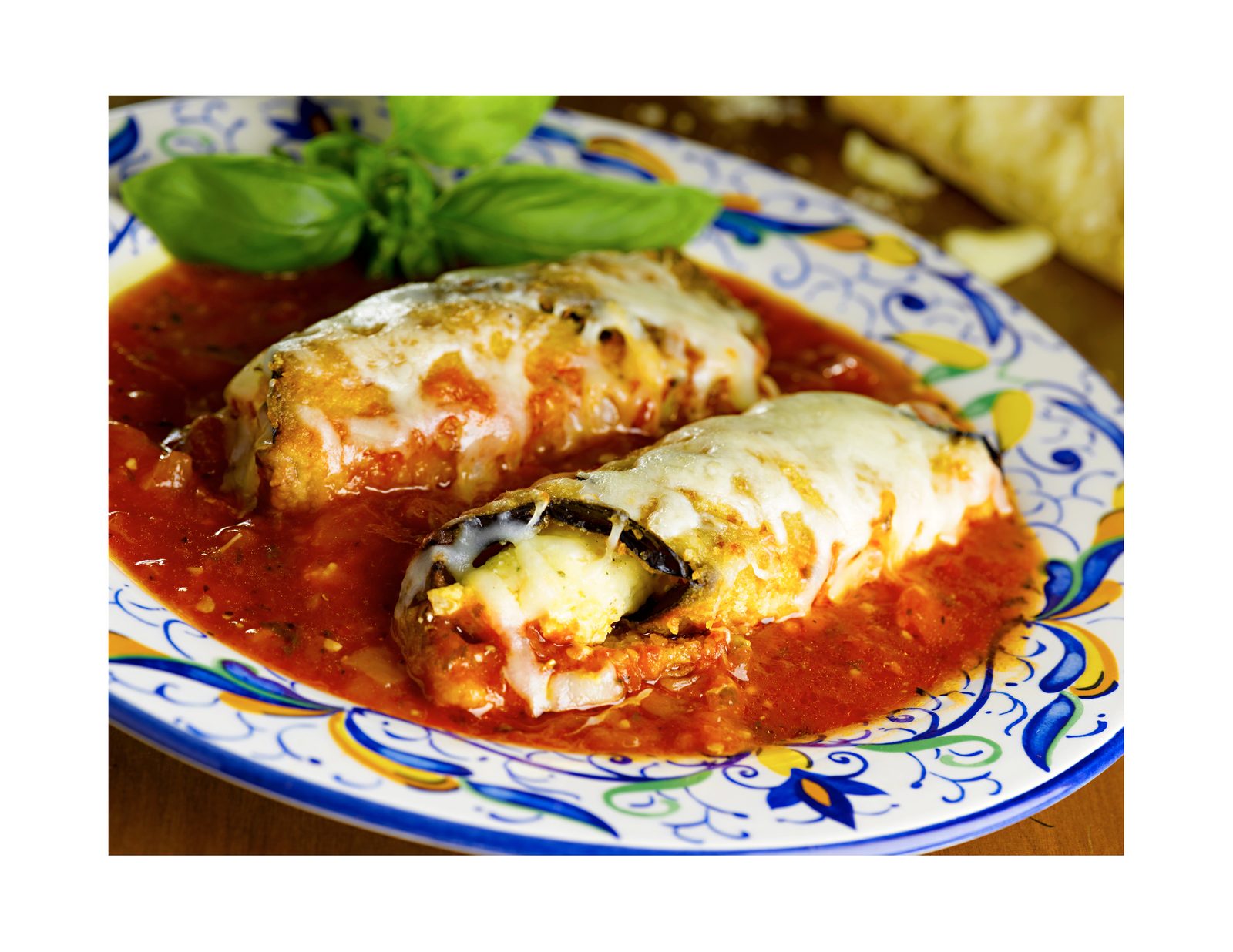 Eggplant parmigiana baked over penne with marinara and melted mozzarella
